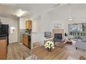 Bright, open-concept living and dining area featuring a cozy fireplace and modern furnishings at 6088 Westgate Dr # 201, Orlando, FL 32835