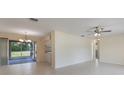 Open living area with tiled floors and sliding glass doors at 622 N Goodrich Dr, Deltona, FL 32725