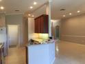 Bright kitchen featuring an open layout, breakfast bar, and ample cabinet space at 8532 Bay Springs Dr, Orlando, FL 32819