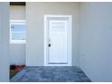 A close up shot of the front door with a keypad entry system at 8600 Castile Rd, Sebring, FL 33876