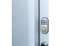 Close-up of the front door's keypad entry system at 8600 Castile Rd, Sebring, FL 33876