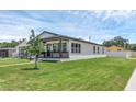 A cozy single Gathering house with a well-kept lawn and a charming front porch at 1050 20 St, Orlando, FL 32805