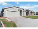 Charming single-Gathering home with a long driveway and two-car garage in a neighborhood setting at 1111 High Vista Dr, Davenport, FL 33837