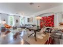 Open living space showcasing the sofa, dining area, and artistic accents at 1521 Chatfield Pl, Orlando, FL 32814