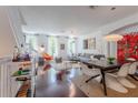 Open living area with hardwood floors, modern furniture, and a dining area at 1521 Chatfield Pl, Orlando, FL 32814