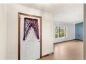 Home entryway and front door with nearby window overlooking the front yard at 2409 Pinyon Ct, Kissimmee, FL 34746