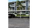 Assigned covered parking spot in front of condo building with palm trees at 25306 Northlake Dr # 25306, Sanford, FL 32773