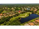 A sprawling community with lush landscaping, lakes, and golf course views at 3512 Legacy Hills Ct, Longwood, FL 32779