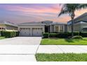 Charming single-story home featuring a well-manicured lawn and a two-car garage at 4737 Maple Park St, Orlando, FL 32811