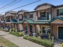 Attractive townhouses with well-maintained landscaping along the sidewalk at 5119 Jones Rd, St Cloud, FL 34771