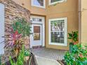 Inviting entryway with stone accents and lush landscaping at 7323 Cypress Grove Rd # 87, Orlando, FL 32819