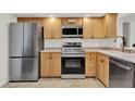 Functional kitchen featuring stainless steel appliances and ample cabinet space, great for cooking at 8248 Limetree Ct, Orlando, FL 32836