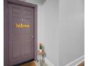 Front door with welcome sign and tulips next to the door at 860 N Orange Ave # 448, Orlando, FL 32801