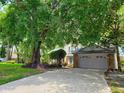 Charming two-story home with mature tree providing ample shade and attractive curb appeal at 983 Bucksaw Pl, Longwood, FL 32750