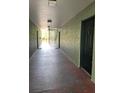 Hallway leading to stairwell with multiple apartment entrances at 2007 Dixie Belle Dr # 2007 M, Orlando, FL 32812