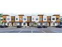 Contemporary townhouses with a neatly arranged parking area and appealing architectural design at 213 Breezeway Dr, Davenport, FL 33897