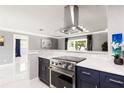 Kitchen with stainless steel appliances, modern cabinets and countertops at 226 Selkirk Way, Longwood, FL 32779