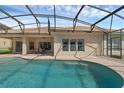 Inviting pool with an expansive patio area perfect for outdoor entertaining and relaxation, featuring a screened enclosure at 2801 Boat Cove Cir, Kissimmee, FL 34746
