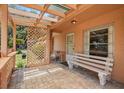 Inviting front porch with brick flooring and a cozy seating area at 2933 N Chickasaw Trl, Orlando, FL 32817