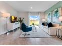 Bright living room with large windows offering scenic views, comfortable seating, and stylish decor at 3635 Fort Mellon Ln, Sanford, FL 32773