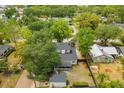 Aerial view of home, lush backyard, a detached garage and neighboring properties at 490 Shoreview Ave, Winter Park, FL 32789