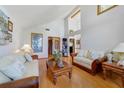 Spacious living room with high ceilings, wood floors, and stylish decor at 513 Sabal Trail Cir, Longwood, FL 32779