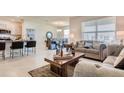 Open concept living space with modern furniture, stainless steel appliances, and a dining area at 5169 Masser Rd, St Cloud, FL 34772