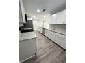 Spacious kitchen featuring granite countertops, stainless steel appliances, and ample cabinet space at 534 Central Ave, Frostproof, FL 33843