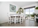 Bright dining area with a sliding glass door to a private balcony, perfect for relaxing at 818 Kapi Dr, Groveland, FL 34736