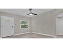 Bright bedroom featuring a large window, door and spacious closet at 900 Citrus St, Orlando, FL 32805