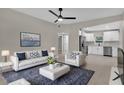 Open-concept living room flows into modern kitchen with stainless steel appliances at 900 Citrus St, Orlando, FL 32805