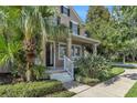 Inviting home exterior showcasing a well-manicured lawn and tropical foliage at 9189 Camden Gardens St, Orlando, FL 32827