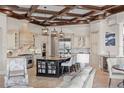 Gourmet kitchen with custom cabinets, granite counters, stainless steel appliances, and a center island at 14724 Avenue Of The Rushes, Winter Garden, FL 34787