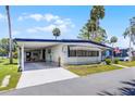 Welcoming single-story home with covered parking and charming curb appeal at 200 Palm Meadows Dr, Eustis, FL 32726