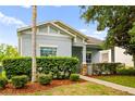 Well-maintained single-story home featuring a landscaped front yard, a combination of stone, and neutral exterior paint at 2125 Shackley Pl, Apopka, FL 32703