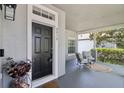 Comfortable front porch with seating area, perfect for relaxing outdoors at 2215 Guiana Plum Dr, Orlando, FL 32828