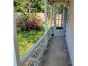 View of the side porch, showcasing the yard, fence, and exterior entrance at 2320 Pebble Brook Rd, Kissimmee, FL 34741