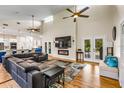 Spacious living room with high ceilings, hardwood floors, fireplace, and open floor plan at 2326 Florida Ave, Oviedo, FL 32765