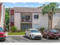 Condo exterior view, showcasing a private balcony with seating and convenient parking at 2486 Citrus Club Ln # 408, Orlando, FL 32839