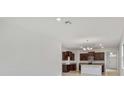 Open concept living area with kitchen, dining area and front entrance with lots of light at 3975 Kennebunk Loop, Mount Dora, FL 32757