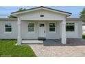 Close up of inviting front porch featuring classic columns at 4816 Crow St, Orlando, FL 32819
