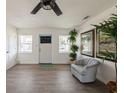 Bright living room with modern gray flooring, large windows, and stylish decor at 4816 Crow St, Orlando, FL 32819