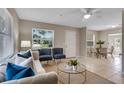 Inviting living room with natural light, neutral tones, and a comfortable seating arrangement at 614 Plum Ln, Altamonte Springs, FL 32701