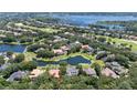 Scenic aerial of home in an upscale community with ponds and golf course at 6161 Blakeford Dr, Windermere, FL 34786