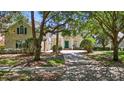 Attractive two-story home with a green front door and mature landscaping at 6161 Blakeford Dr, Windermere, FL 34786