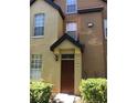 The home's entrance features a black awning and a brown front door at 6304 Raleigh St # 204, Orlando, FL 32835