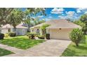 Attractive single-Gathering home with a well-kept lawn and attached two-car garage at 7900 Saint Giles Pl, Orlando, FL 32835