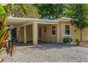 Charming single-story home featuring a covered carport and well-maintained landscaping at 11 Plumosa Ave, Casselberry, FL 32707