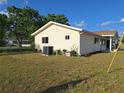 Side view of home showcasing the yard and well-maintained exterior at 11282 Sw 62Nd Avenue Rd, Ocala, FL 34476