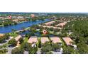 Breathtaking aerial view showcasing waterfront homes and lush landscaping in community at 12185 Obelia Ln, Orlando, FL 32827
